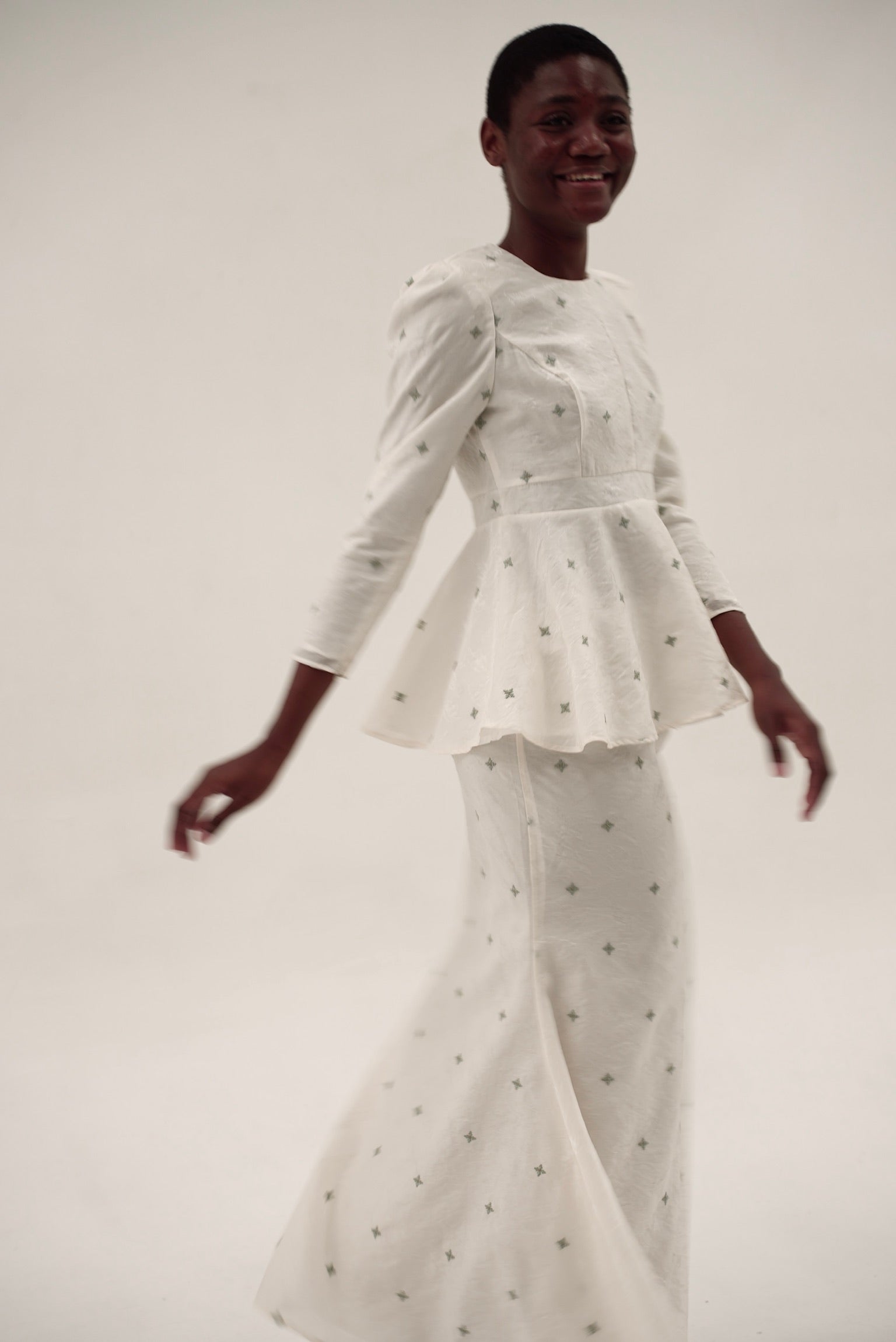 Detail of Kurung Lara showing contoured bodice and subtle sheen fabric with motif