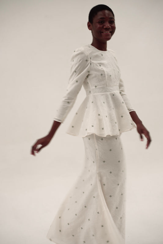 Detail of Kurung Lara showing contoured bodice and subtle sheen fabric with motif