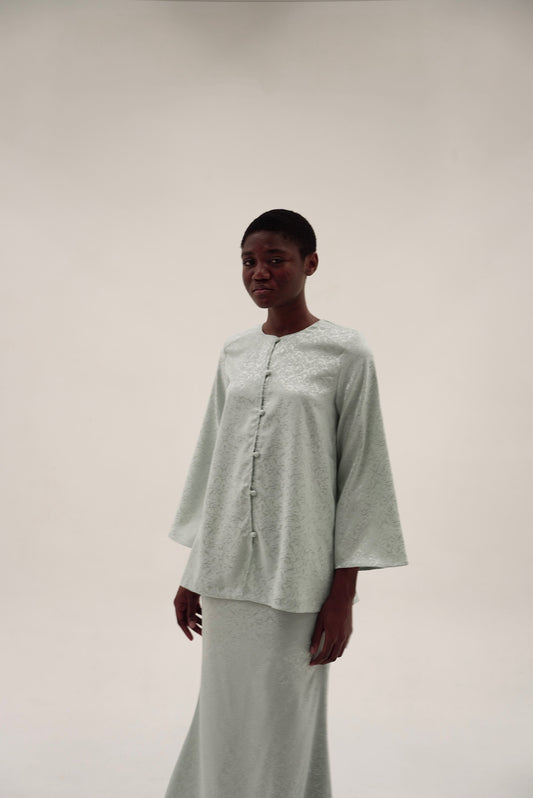 Kurung Rumi in sage blouse detail showing subtle sheen and clean lines