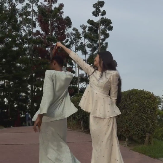 Modern kurung set kurung Lara and kurung Rumi in motion dancing and flowing