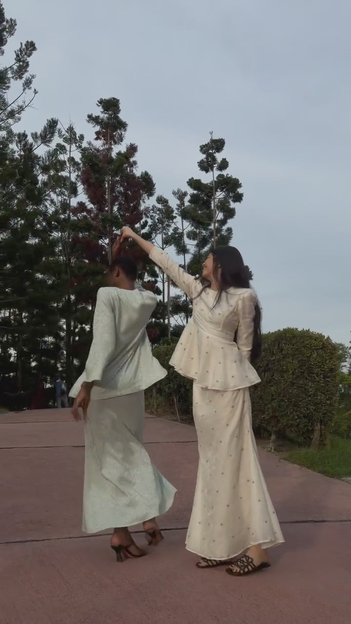 Modern kurung set kurung Lara and kurung Rumi in motion dancing and flowing